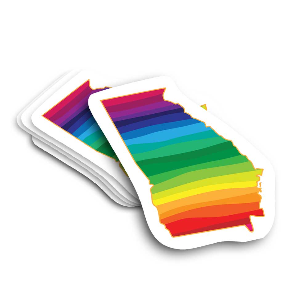 Stack of rainbow-colored Georgia-shaped stickers on a white background