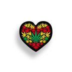 Heart-shaped sticker with colorful cannabis leaf design on a black background with yellow, green and reds